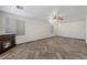 Spacious living room featuring an electric fireplace, ceiling fan, and wood-look floors at 610 Roberta Alecia Ave, North Las Vegas, NV 89031