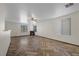 Spacious living room with fireplace, multiple windows, and herringbone floors at 610 Roberta Alecia Ave, North Las Vegas, NV 89031