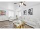 Inviting living room featuring white furniture, modern decor, and lots of natural light at 610 Roberta Alecia Ave, North Las Vegas, NV 89031