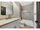 Modern bathroom with a shower/tub combo and gray tile at 62 Incline Village Ct, Henderson, NV 89074