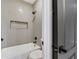 Modern bathroom with tub shower combo and gray tile at 62 Incline Village Ct, Henderson, NV 89074