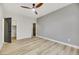 Spacious bedroom with ceiling fan and gray accent wall at 62 Incline Village Ct, Henderson, NV 89074