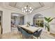 Elegant dining room featuring a large table and modern chandelier at 62 Incline Village Ct, Henderson, NV 89074