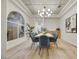 Bright dining room with a large table and modern chandelier at 62 Incline Village Ct, Henderson, NV 89074