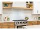 Modern kitchen with gas range and wood shelving at 62 Incline Village Ct, Henderson, NV 89074