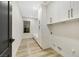 Bright laundry room with built-in cabinets and shelving at 62 Incline Village Ct, Henderson, NV 89074