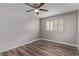 Bright bedroom with wood-look flooring and ceiling fan at 6412 Miragrande Dr, Las Vegas, NV 89108