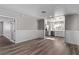 Eat-in kitchen featuring white cabinets and wood-look floors at 6412 Miragrande Dr, Las Vegas, NV 89108