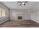 Living room with fireplace and wood-look floors at 6412 Miragrande Dr, Las Vegas, NV 89108