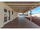 Covered patio with tile flooring and access to backyard at 6412 Miragrande Dr, Las Vegas, NV 89108