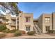 Exterior view of a two-story building with stairs and landscaping at 6800 E Lake Mead Blvd # 1047, Las Vegas, NV 89156