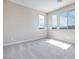 Well-lit bedroom featuring neutral wall paint and carpet at 6828 Pacific Robin St, North Las Vegas, NV 89084