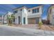 Two-story home with modern design, attached garage, and landscaping at 6828 Pacific Robin St, North Las Vegas, NV 89084