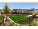 A lively playground with vibrant green turf, offering a fun and safe recreational area for and families at 6828 Pacific Robin St, North Las Vegas, NV 89084