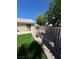 Landscaped backyard with artificial turf and block wall at 707 Arrowhead Trl, Henderson, NV 89002