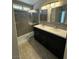 Modern bathroom with double vanity and shower at 707 Arrowhead Trl, Henderson, NV 89002