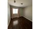 Bright bedroom with dark hardwood floors and neutral walls at 707 Arrowhead Trl, Henderson, NV 89002