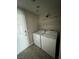 Laundry room with washer, dryer, and shelving at 707 Arrowhead Trl, Henderson, NV 89002