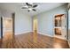 Bedroom with wood floors, ceiling fan and en-suite bathroom at 7131 Celadine St, Las Vegas, NV 89131