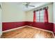 Bright bedroom with wood floors and ceiling fan at 7131 Celadine St, Las Vegas, NV 89131