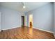 Light bedroom with wood floors, ceiling fan and en-suite bathroom at 7131 Celadine St, Las Vegas, NV 89131