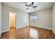 Bedroom with wood floors, ceiling fan and walk-in closet at 7131 Celadine St, Las Vegas, NV 89131