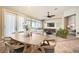 Bright dining room with wood table and chairs, adjacent to living room at 7131 Celadine St, Las Vegas, NV 89131