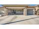 Spacious two-car garage with built-in cabinets and ample storage at 7131 Celadine St, Las Vegas, NV 89131