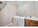 Laundry room with washer, dryer, and utility sink at 7131 Celadine St, Las Vegas, NV 89131