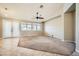 Living room features a ceiling fan and access to a patio at 7131 Celadine St, Las Vegas, NV 89131