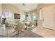 Bright living room with staged furniture and neutral color palette at 7131 Celadine St, Las Vegas, NV 89131