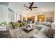 Open concept living room with kitchen access and a neutral color scheme at 7131 Celadine St, Las Vegas, NV 89131