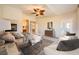 Main bedroom with fireplace, sitting area, and access to balcony at 7131 Celadine St, Las Vegas, NV 89131