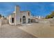 View of the home's backyard, showing a patio and gravel at 7214 Paradise Bay Dr, Las Vegas, NV 89119