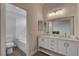 Elegant bathroom featuring a double vanity, bathtub, and modern finishes at 7214 Paradise Bay Dr, Las Vegas, NV 89119