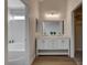 Elegant bathroom featuring a double vanity, bathtub, and modern finishes at 7214 Paradise Bay Dr, Las Vegas, NV 89119