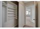 Bright closet featuring built-in shelving for optimal storage and organization space at 7214 Paradise Bay Dr, Las Vegas, NV 89119