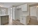 Kitchen with white cabinets, quartz countertops, and pantry at 7214 Paradise Bay Dr, Las Vegas, NV 89119