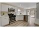 Modern kitchen featuring stainless steel appliances and an eat-in area at 7214 Paradise Bay Dr, Las Vegas, NV 89119