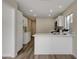 Modern kitchen with white cabinets and quartz counters at 7214 Paradise Bay Dr, Las Vegas, NV 89119