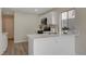 Modern kitchen with white cabinets and quartz counters at 7214 Paradise Bay Dr, Las Vegas, NV 89119