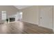 Living room with hardwood floors and a fireplace at 7214 Paradise Bay Dr, Las Vegas, NV 89119