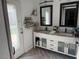 Bathroom features a double vanity and a door to the backyard at 7221 Tempest Pl, Las Vegas, NV 89145