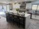 Modern kitchen with white cabinets, a large island, and stainless steel appliances at 7221 Tempest Pl, Las Vegas, NV 89145