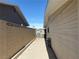 Side yard with concrete pathway and block wall at 7221 Tempest Pl, Las Vegas, NV 89145