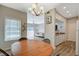 Charming dining area with a round wooden table and chandelier at 7255 W Sunset Rd # 1115, Las Vegas, NV 89113