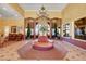 Elegant lobby with seating area and chandelier at 7255 W Sunset Rd # 1115, Las Vegas, NV 89113