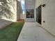 Small backyard with concrete patio and artificial turf at 7627 Alexander Hills St, Las Vegas, NV 89139