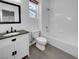 Clean bathroom with tub, toilet and vanity at 7627 Alexander Hills St, Las Vegas, NV 89139