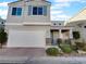 Two-story house with attached garage and landscaped front yard at 7627 Alexander Hills St, Las Vegas, NV 89139